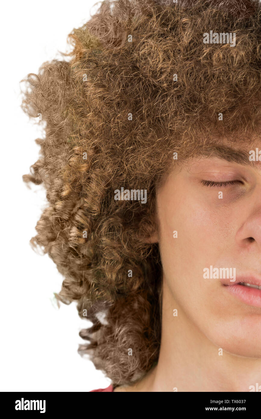 splited in half cropped portrait of a young curly European man with long  curly hair and closed eyes close up. very lush male hair. curling hair  men's Stock Photo - Alamy
