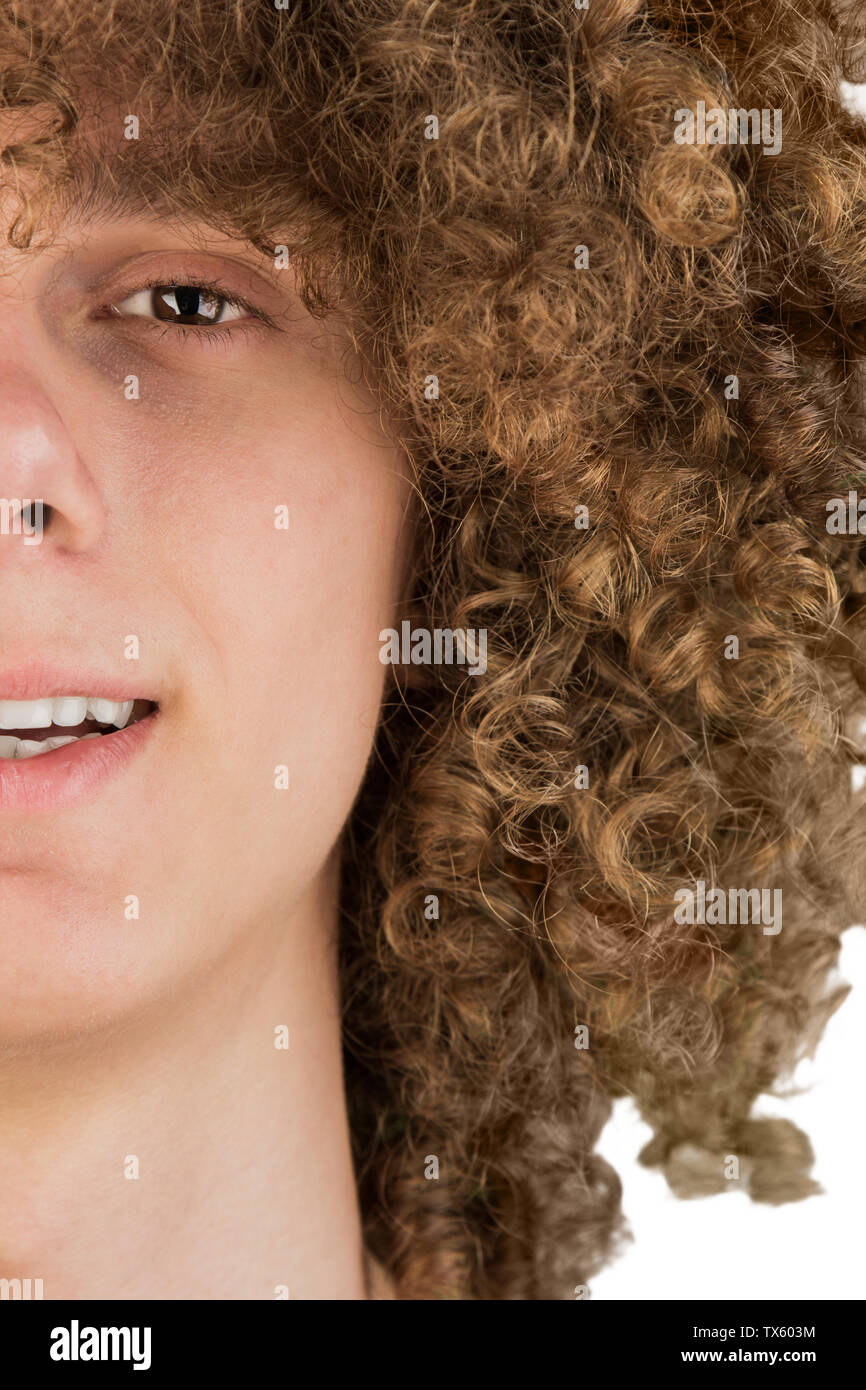 split in half cropped portrait of a young curly European man with long  curly hair and a dreamy smile close-up. very lush male hair. curling hair  men's Stock Photo - Alamy