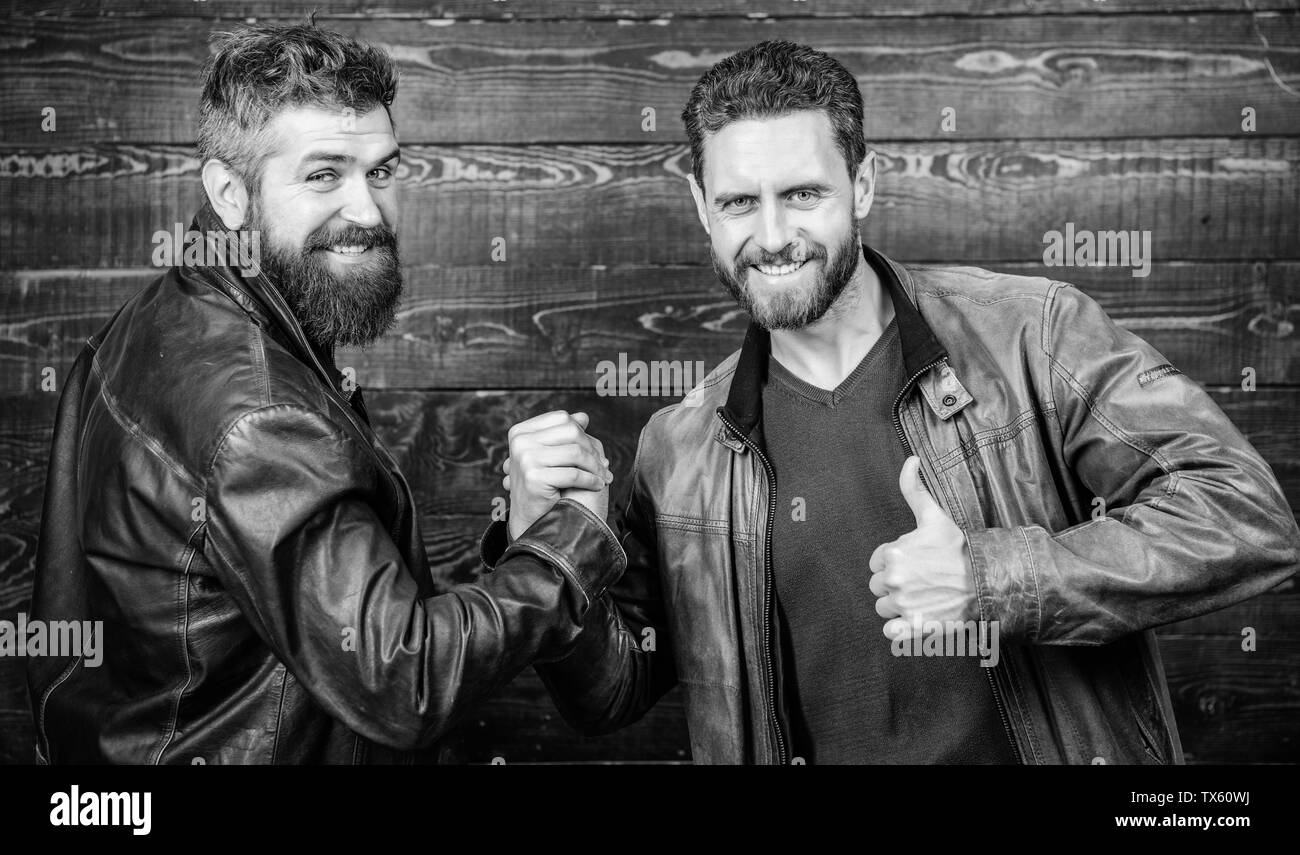 Friendship of brutal guys. Handshake symbol of successful deal ...