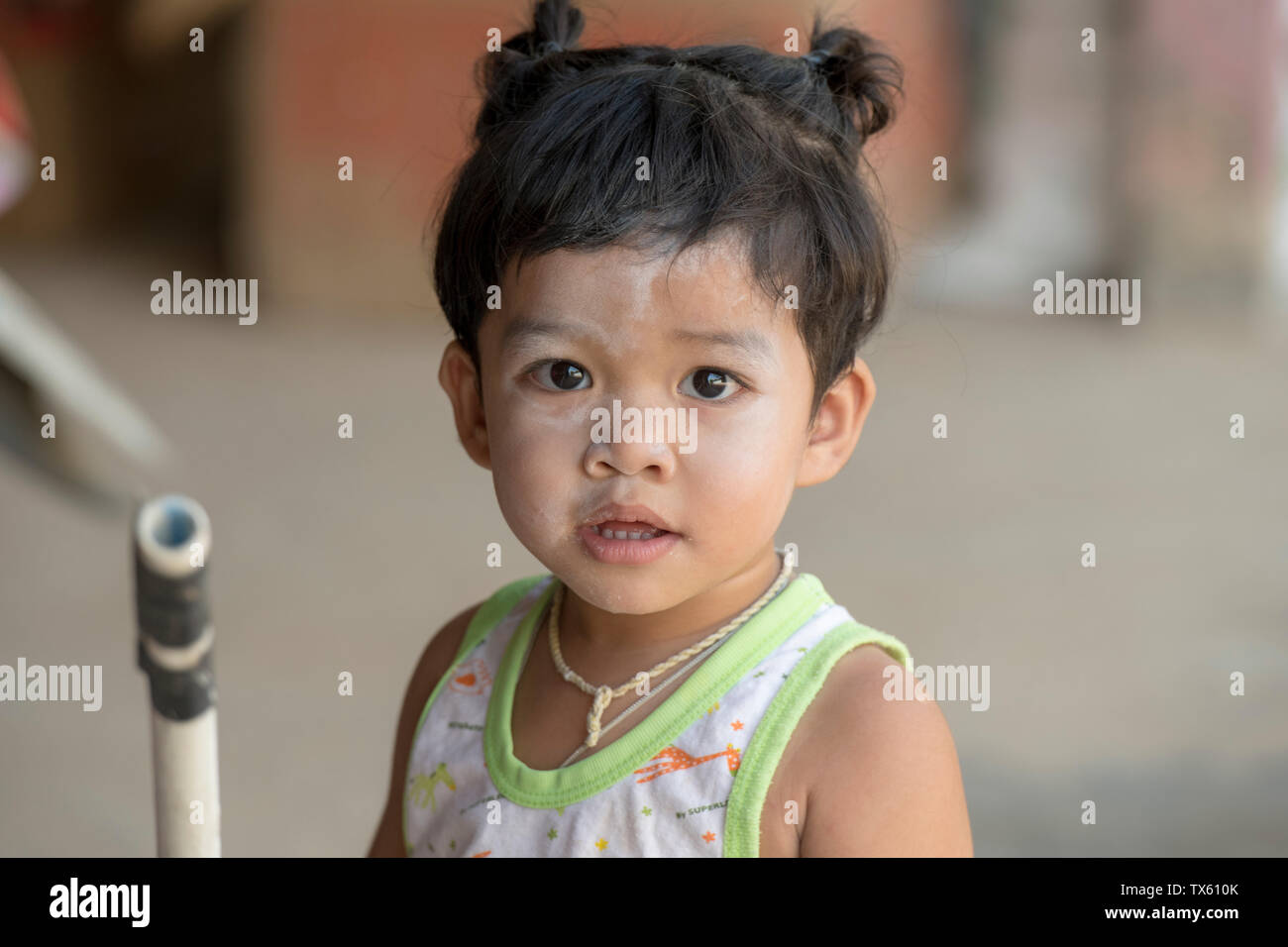 Young girl with cheeky smile Stock Photo - Alamy