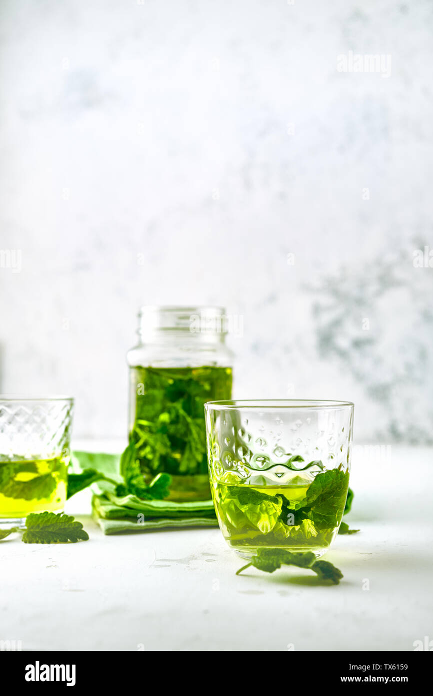 Homemade mint green ice tea in glasses on white background Stock Photo