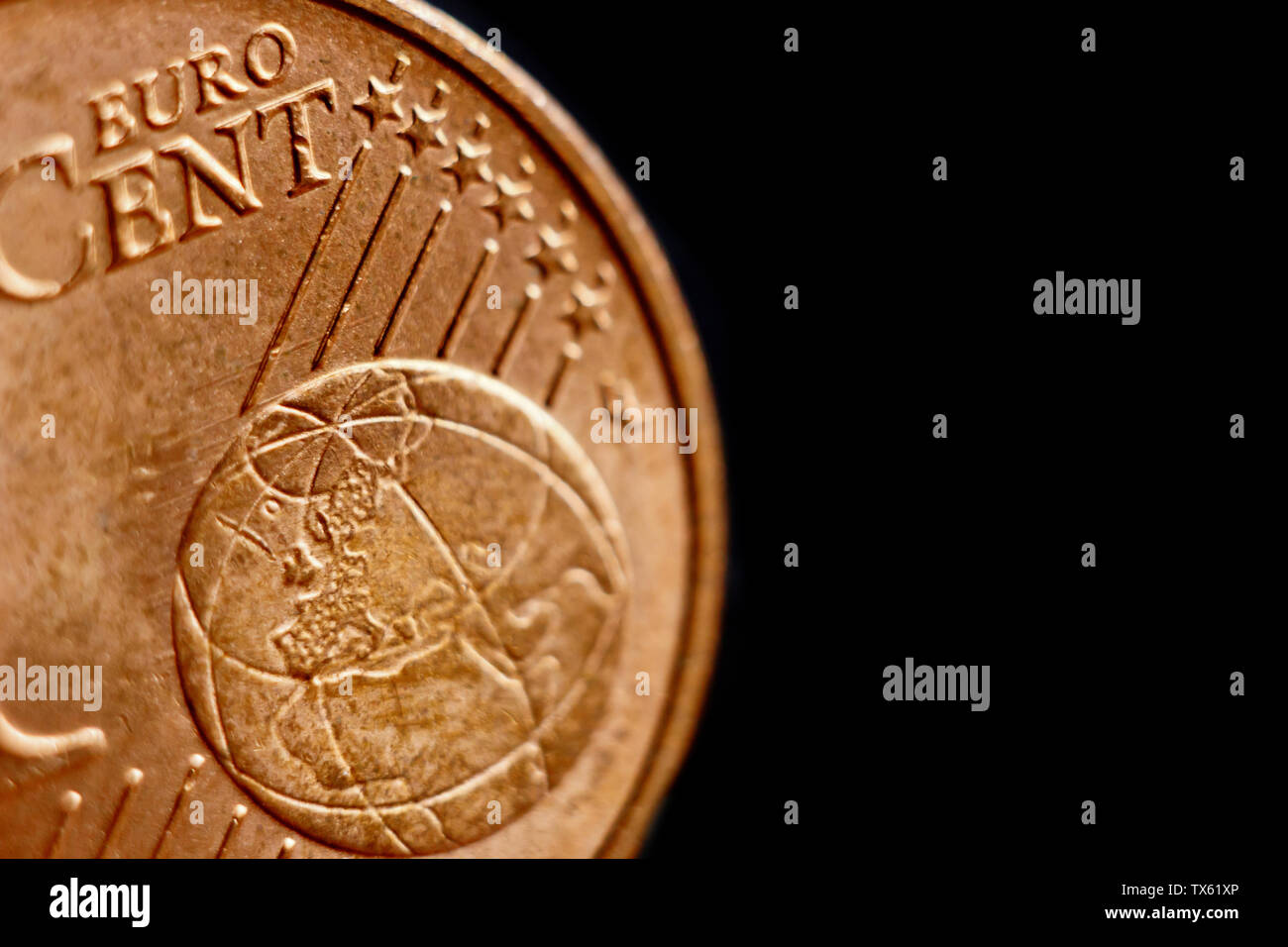 coin one eurocent macro isolated on black background. Detail of metallic money close up. EU money. Stock Photo