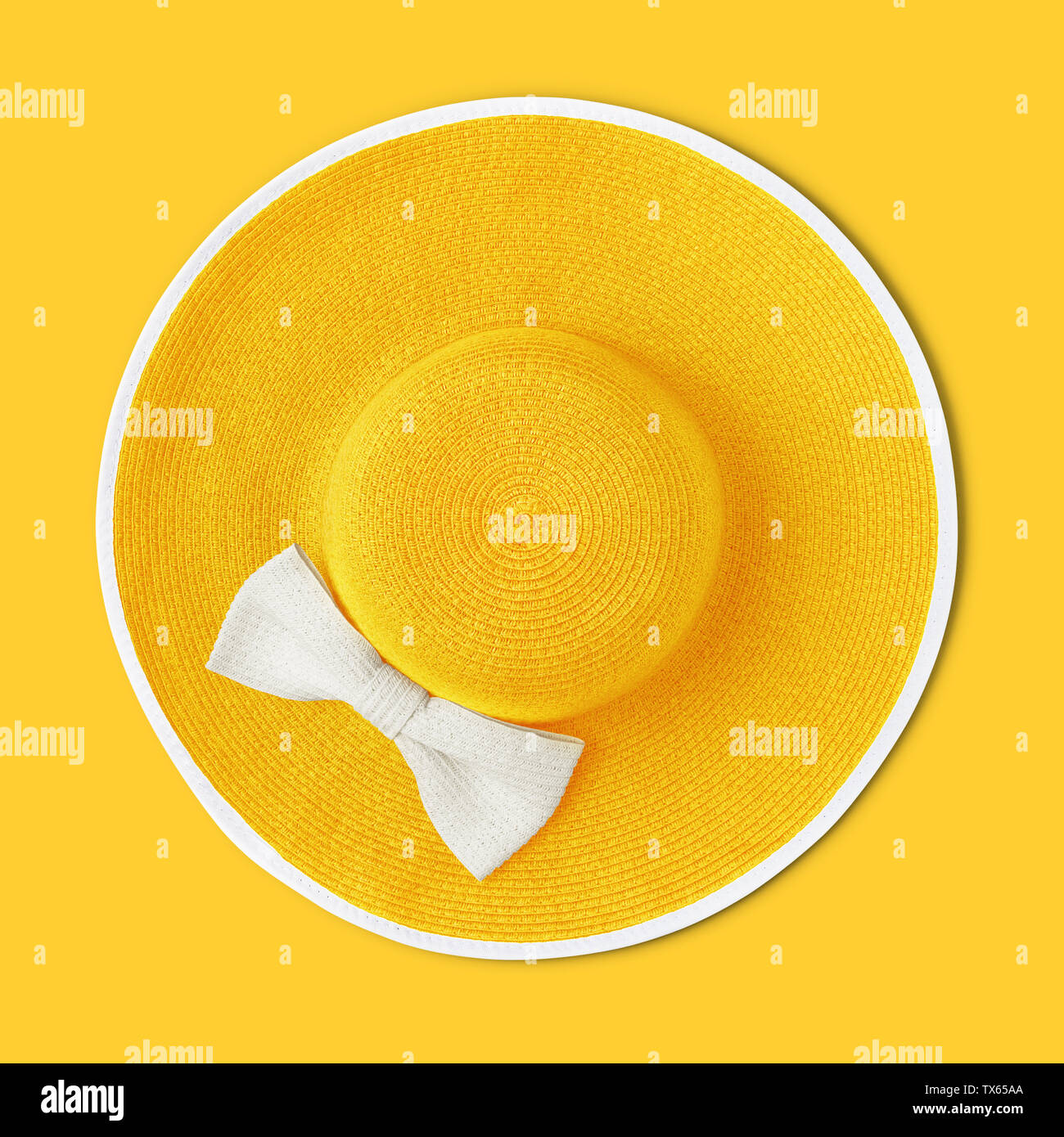 top view summer beach round straw yellow hat with white bow isolated on ...