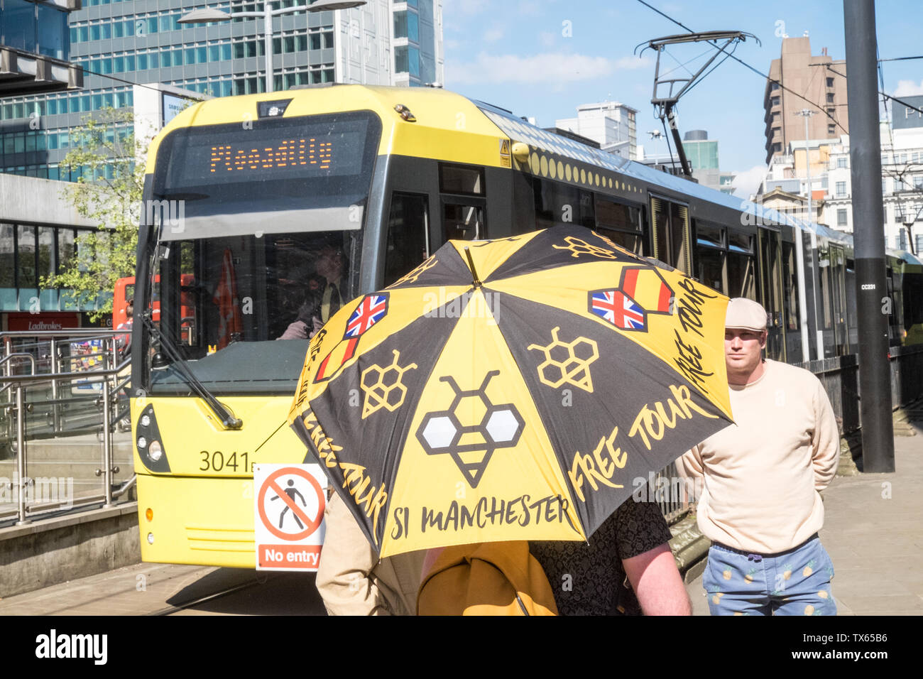 Free,donation,only,guided,tour,bee,symbol,umbrella,Metrolink,Manchester,north,northern,north west,city,England,English,GB,UK,Britain,British,Europe, Stock Photo