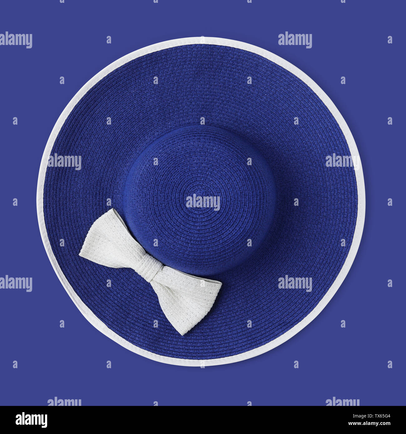 top view summer beach round straw blue hat with white bow isolated on ...