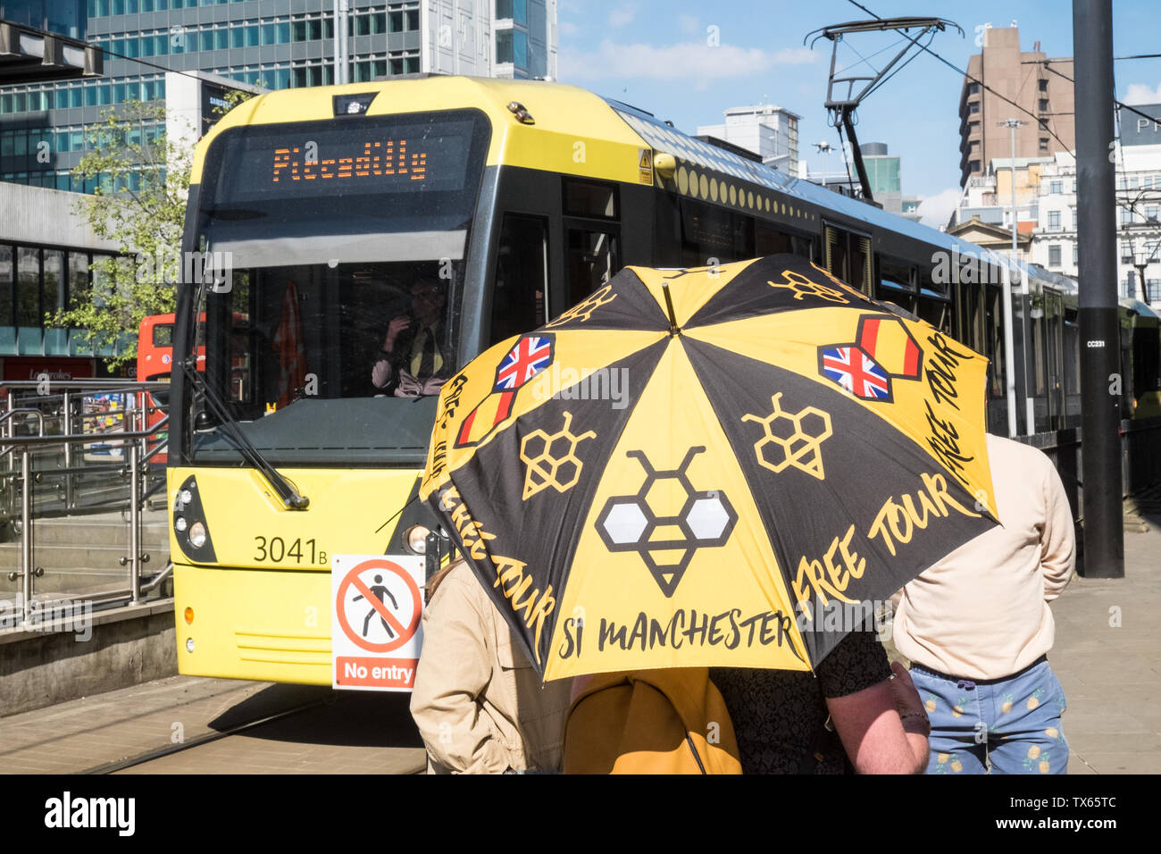 Free,donation,only,guided,tour,bee,symbol,umbrella,Metrolink,Manchester,north,northern,north west,city,England,English,GB,UK,Britain,British,Europe, Stock Photo