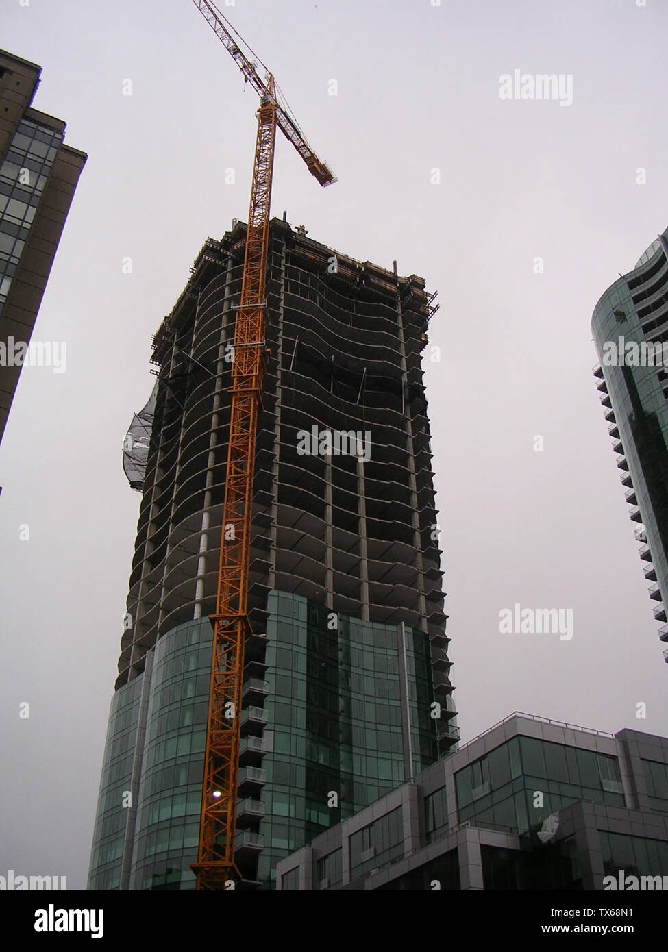 The Infinity (300 Spear Street) complex seen on a stormy day. The crane and tower I are on the left, while the completed tower II is on the right and the Spear Street midrise is on the bottom right.; 23 February 2008; Own work (Original caption:  I created this work entirely by myself); Cheers. Trance addict - Armin van Buuren - Oceanlab; Stock Photo