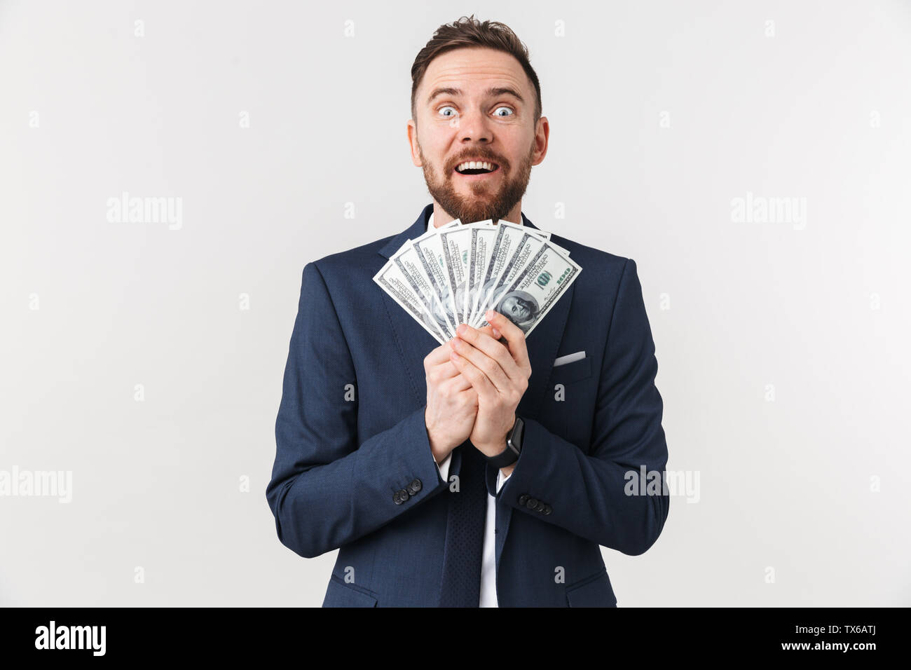 Image of happy young businessman posing isolated over white wall ...