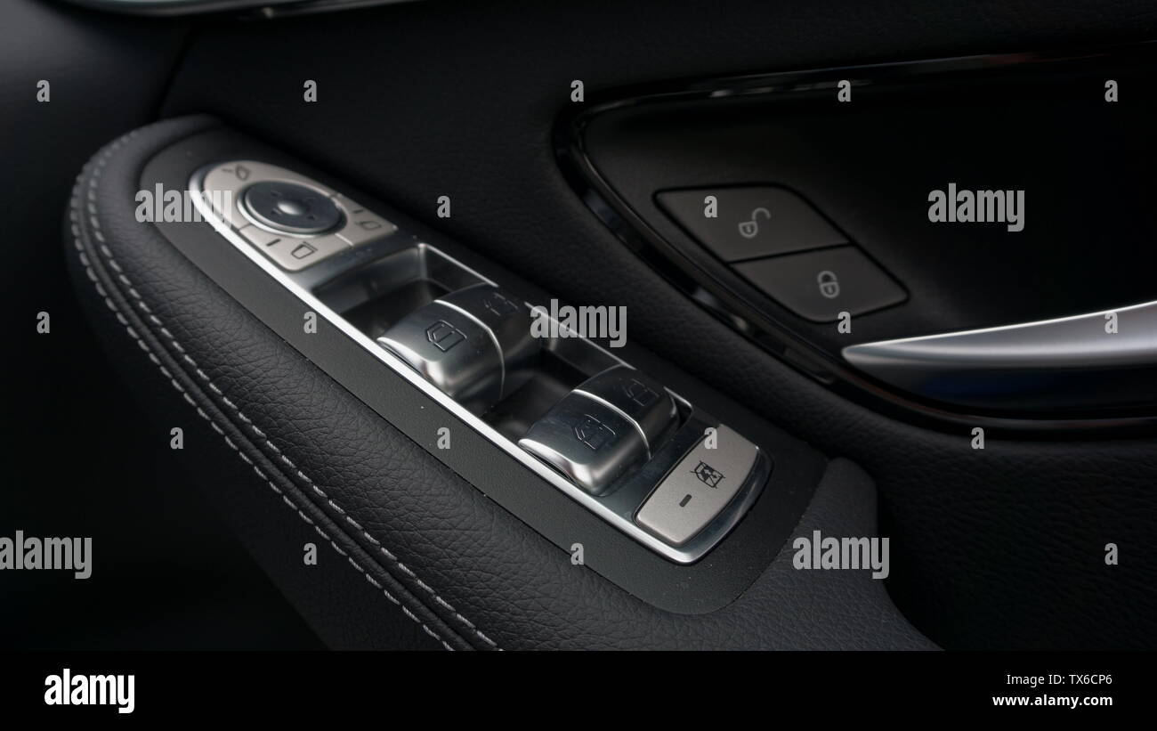 Driver's window and mirror switches in right hand drive car Stock Photo