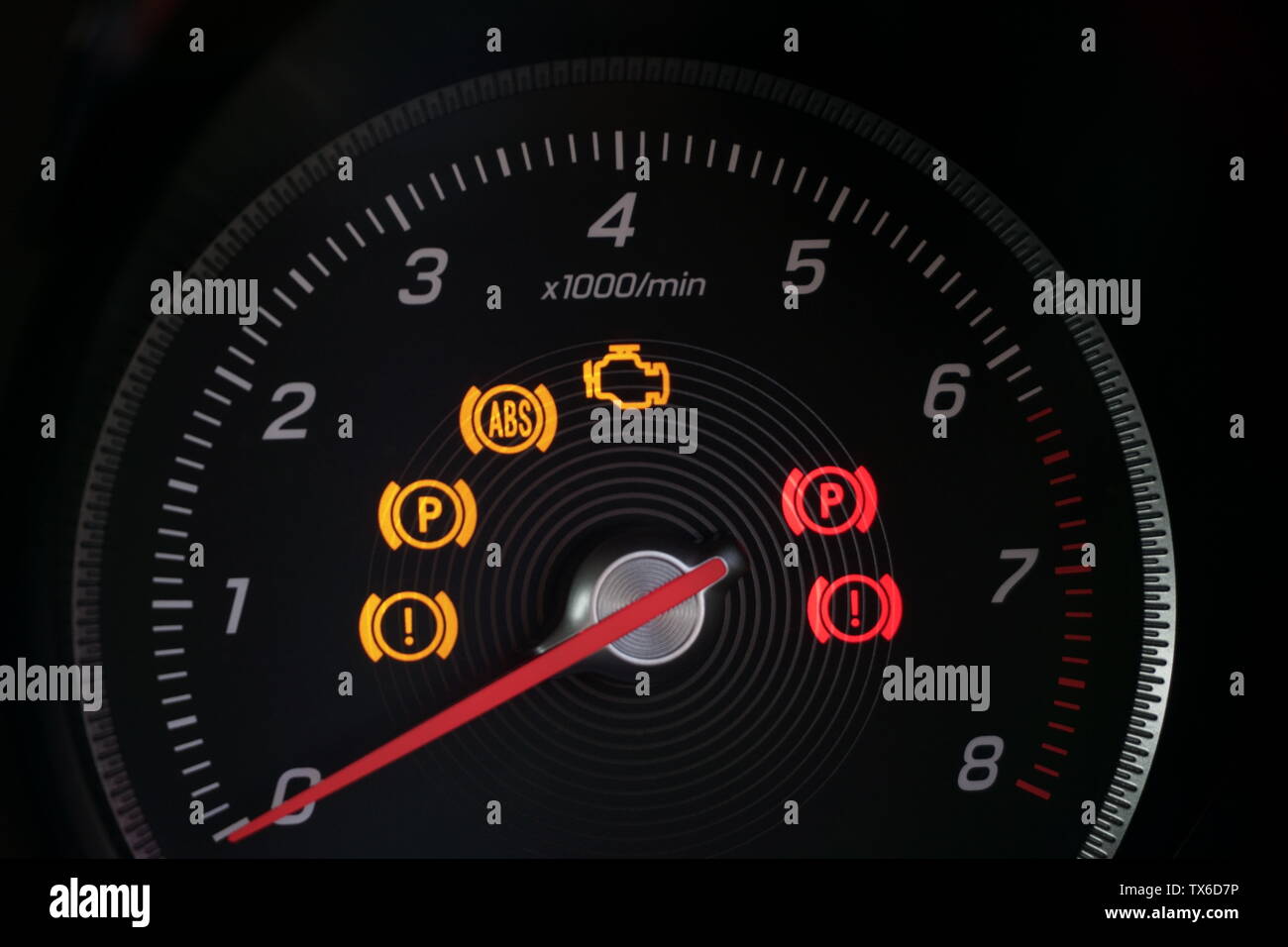 Tachometer with warning lights illuminated Stock Photo