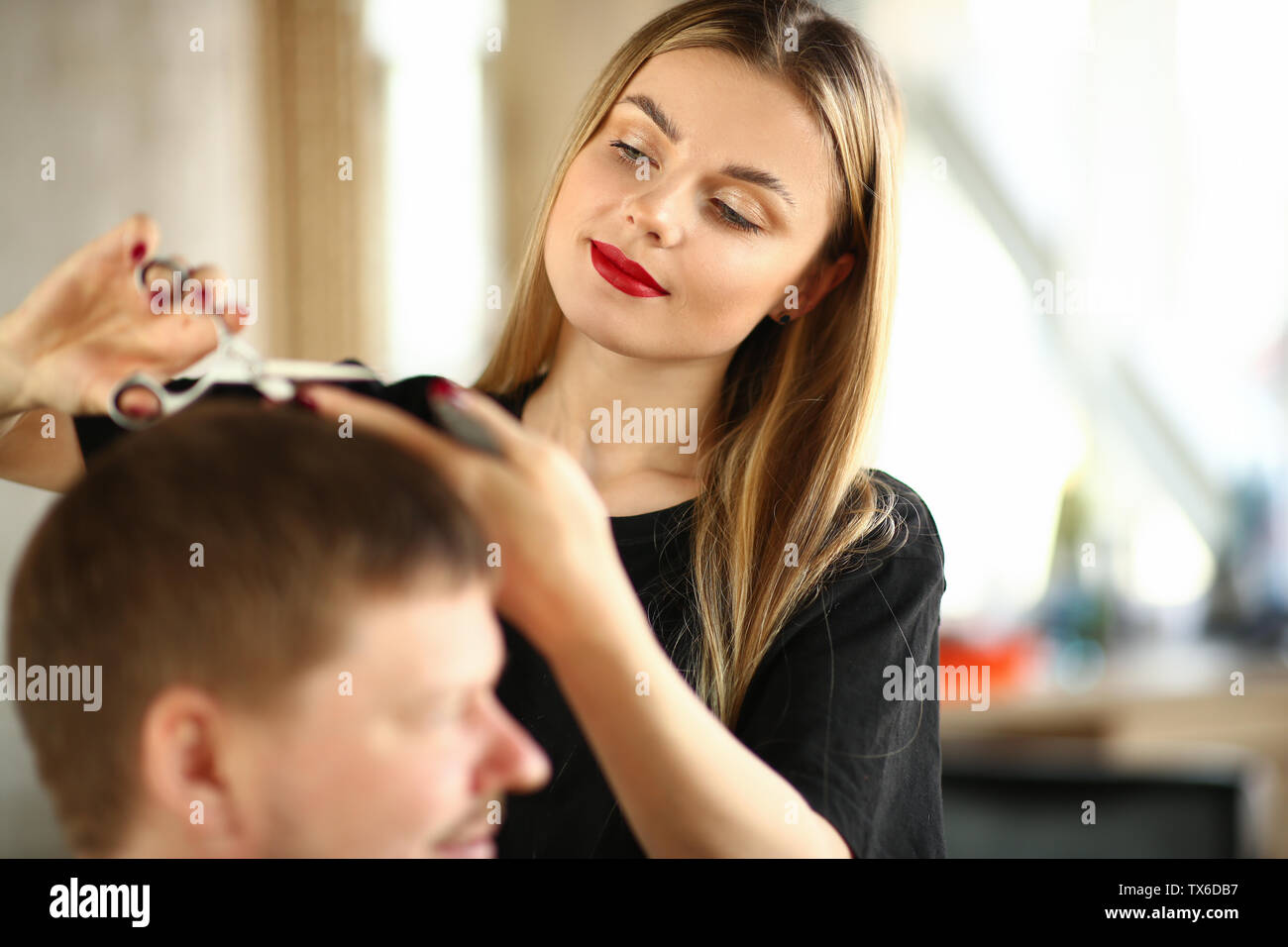 Young Woman Hairstylist Cutting Male Client Hair Beautiful