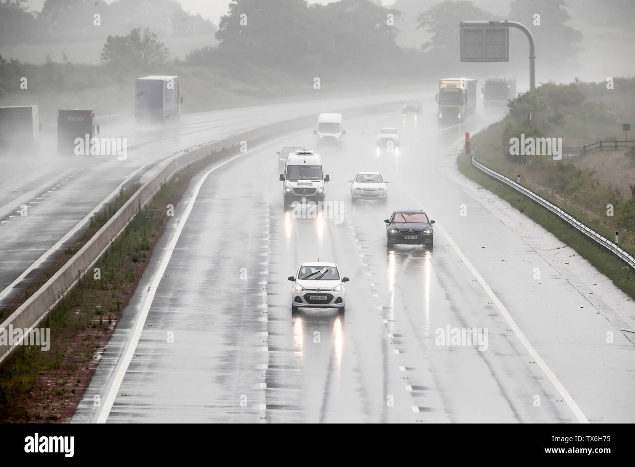 Torrential rain on the A1 near Leeming in Yorkshire on what is expected to be the hottest day of the year, as thunderstorms could bring a month's worth of rain to parts of the UK, before the hottest temperatures of the year so far bring a balmy end to June. Stock Photo