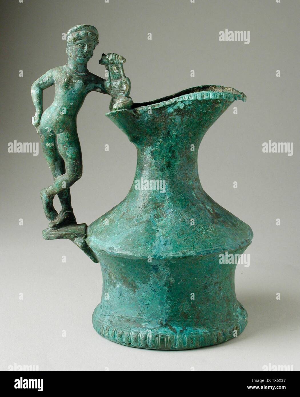 Jug with Handle in the Form of a Musician;  Central Italy, Etruria, early 3rd century B.C. Furnishings; Serviceware Bronze Height:  6 9/16 in. (16.7 cm) Gift of Varya and Hans Cohn (AC1992.152.29) Greek, Roman and Etruscan Art; Early 3rd century B.C.; Stock Photo