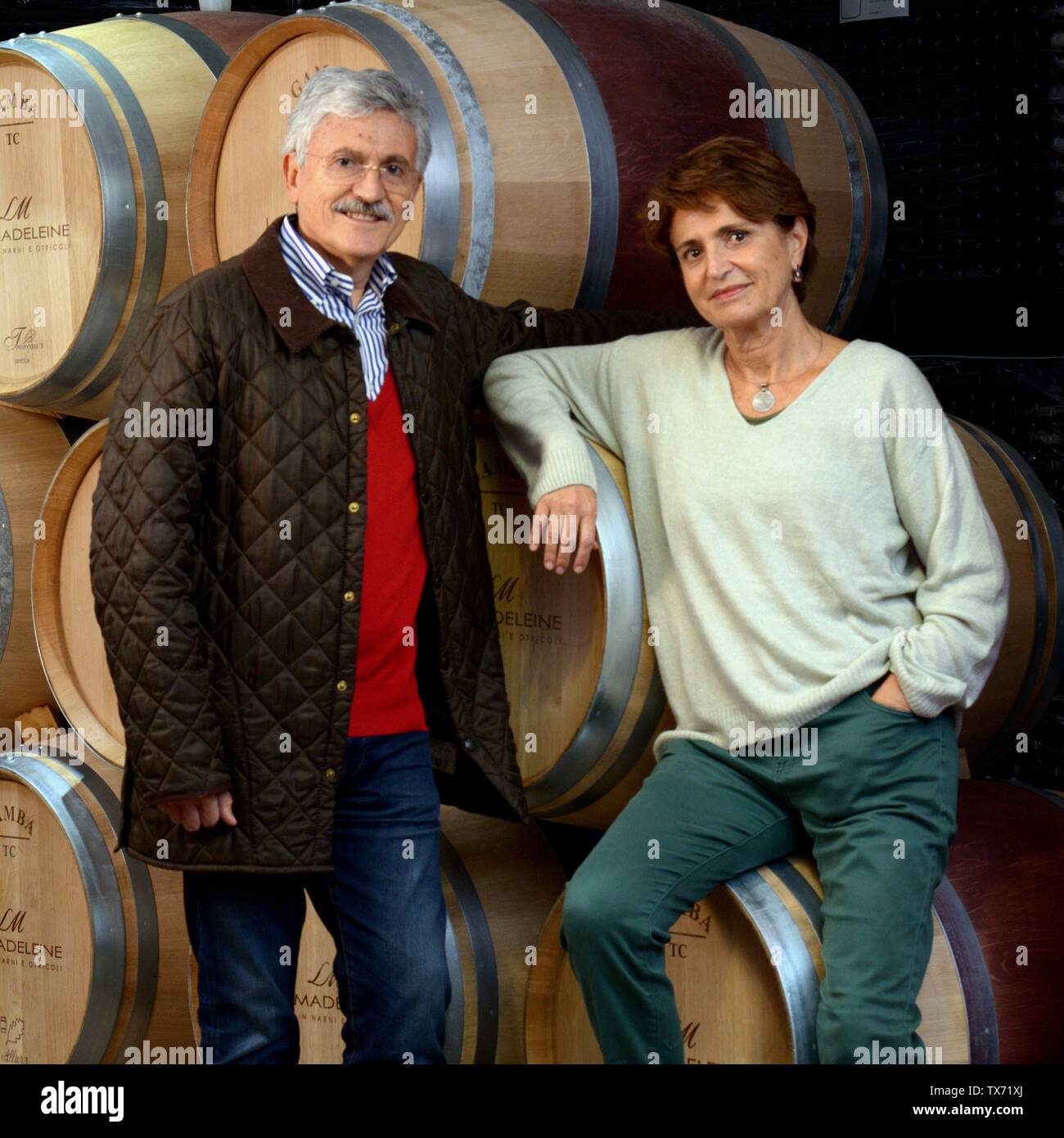 Former italian prime minister and minister of foreing affairs Massimo D'alema and his wife Linda Giuva in the cellar of their estate 'Cantina La Madel Stock Photo