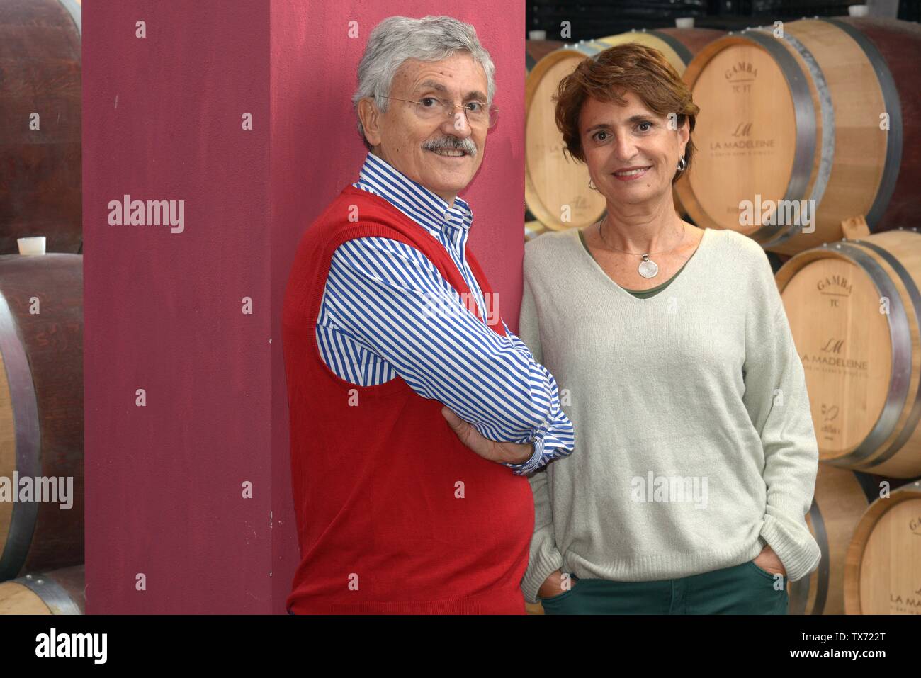 Former italian prime minister and minister of foreing affairs Massimo D'alema and his wife Linda Giuva in the cellar of their estate 'Cantina La Madel Stock Photo