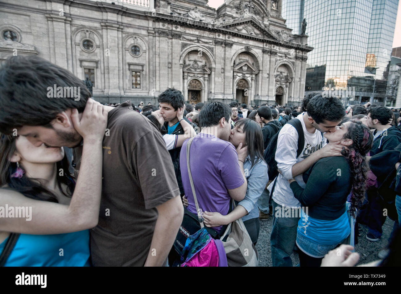 Hundred of couples of students kissing to protest demanding free quality public education, plaza de Armas Santiago de Chile Stock Photo