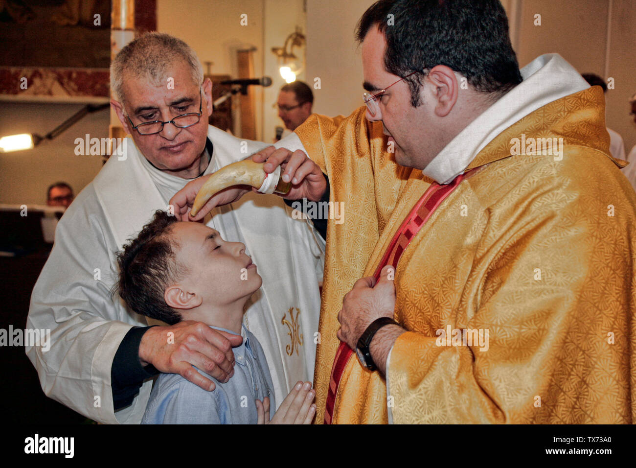 Catholic priest celebrating Confirmation Palermo, Sicily, Italy Stock Photo