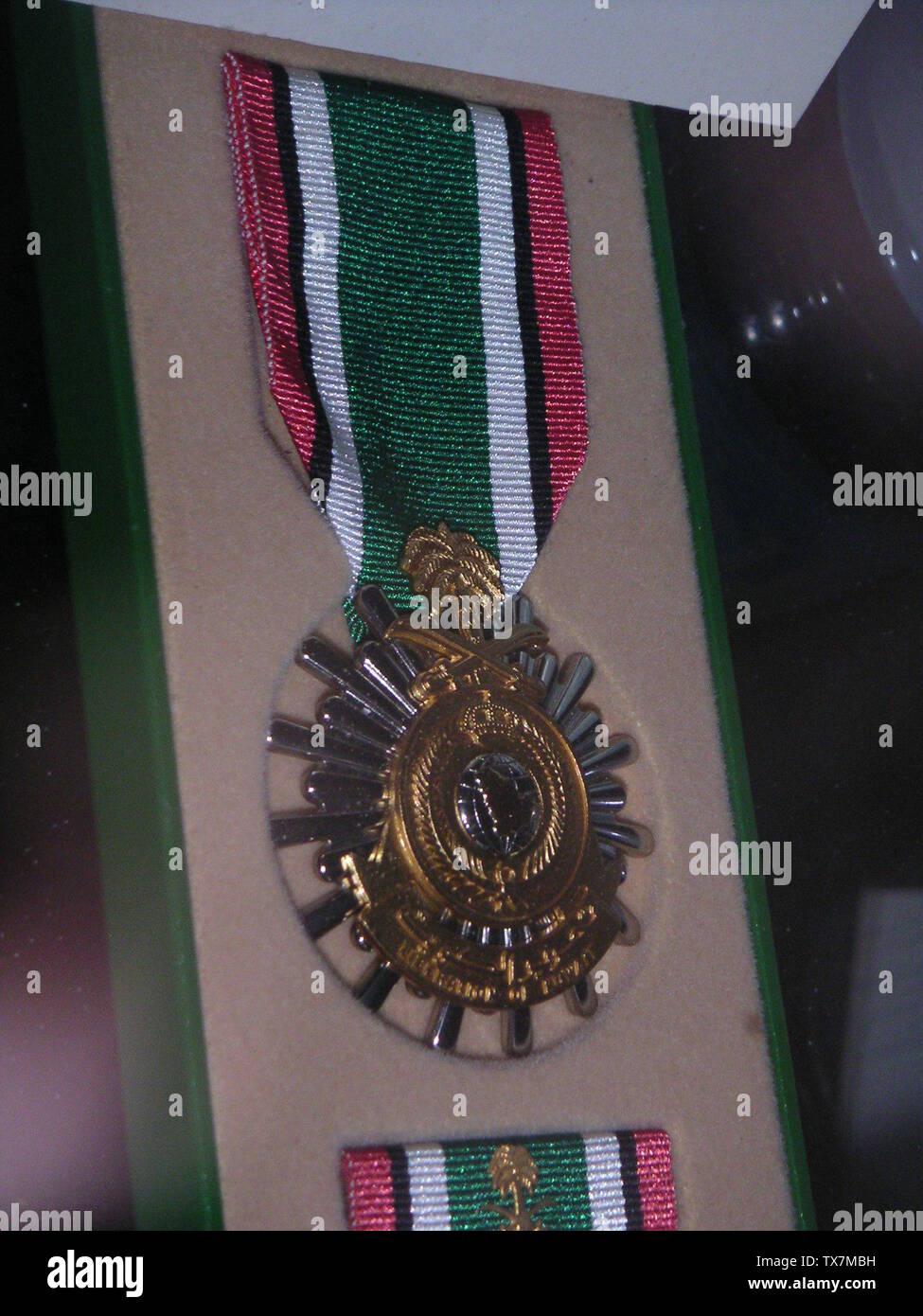 A photograph of the Kuwait Liberation Medal, a military decoration given to members of the U.S. military for service during the Persian Gulf War. Photograph taken by me in the Museum of Florida's Military in St. Augustine, Florida on August 7, 2004. Released into public domain.; 3 September 2004 (original upload date); Transferred from en.pedia to Commons by Premeditated Chaos using CommonsHelper.; Neutrality at English pedia; Stock Photo