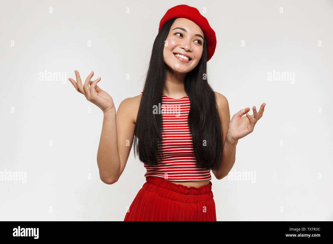 Photo of a beautiful young pretty asian happy woman posing isolated ...