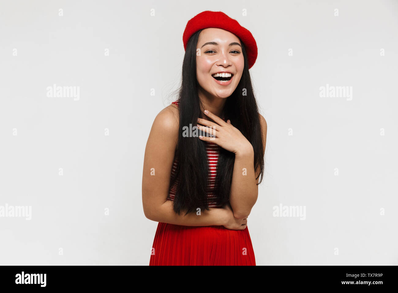 Photo of a beautiful young pretty asian happy woman posing isolated ...