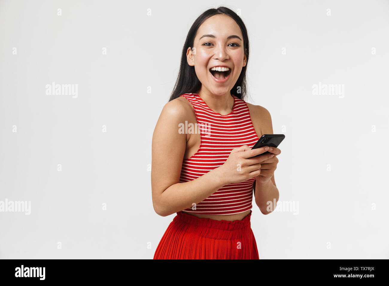 Photo of a beautiful young pretty asian happy woman posing isolated ...