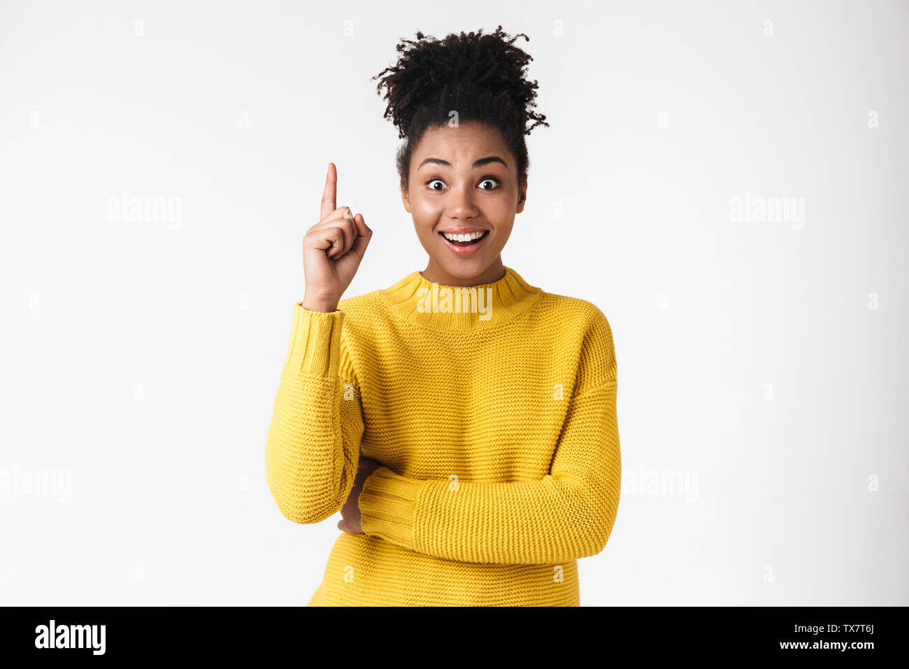 Photo of a beautiful young african woman posing isolated over white ...
