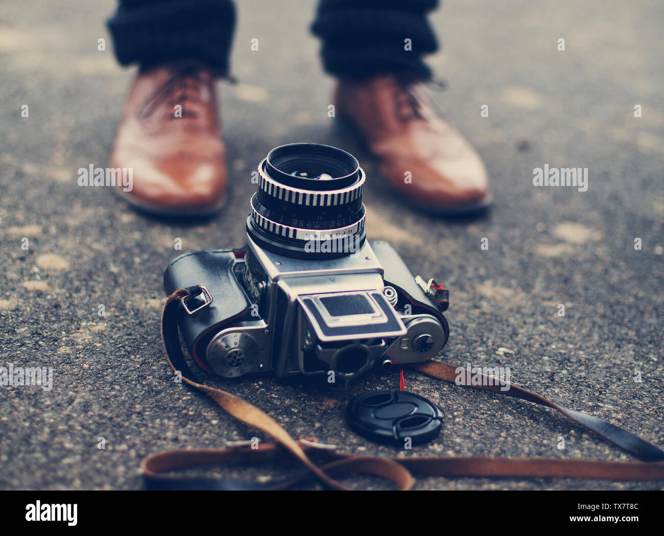 camera on a floor infront of feet Stock Photo