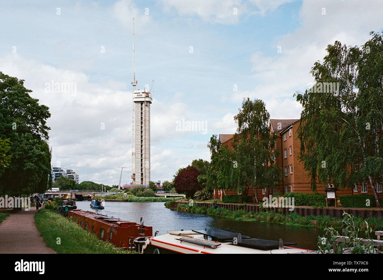 The River Lea Navigation near Tottenham Hale, North London UK, with the new Hale Wharf housing development under construction in the background Stock Photo