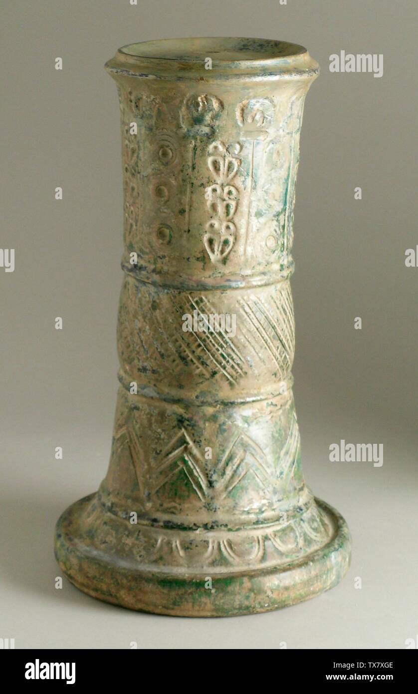 Lampstand;  Iraq, Iran, Syria, or Egypt, first half of 8th century Furnishings; Lighting Earthenware, incised, stamped, and glazed The Madina Collection of Islamic Art, gift of Camilla Chandler Frost (M.2002.1.88) Islamic Art; First half of 8th century; Stock Photo