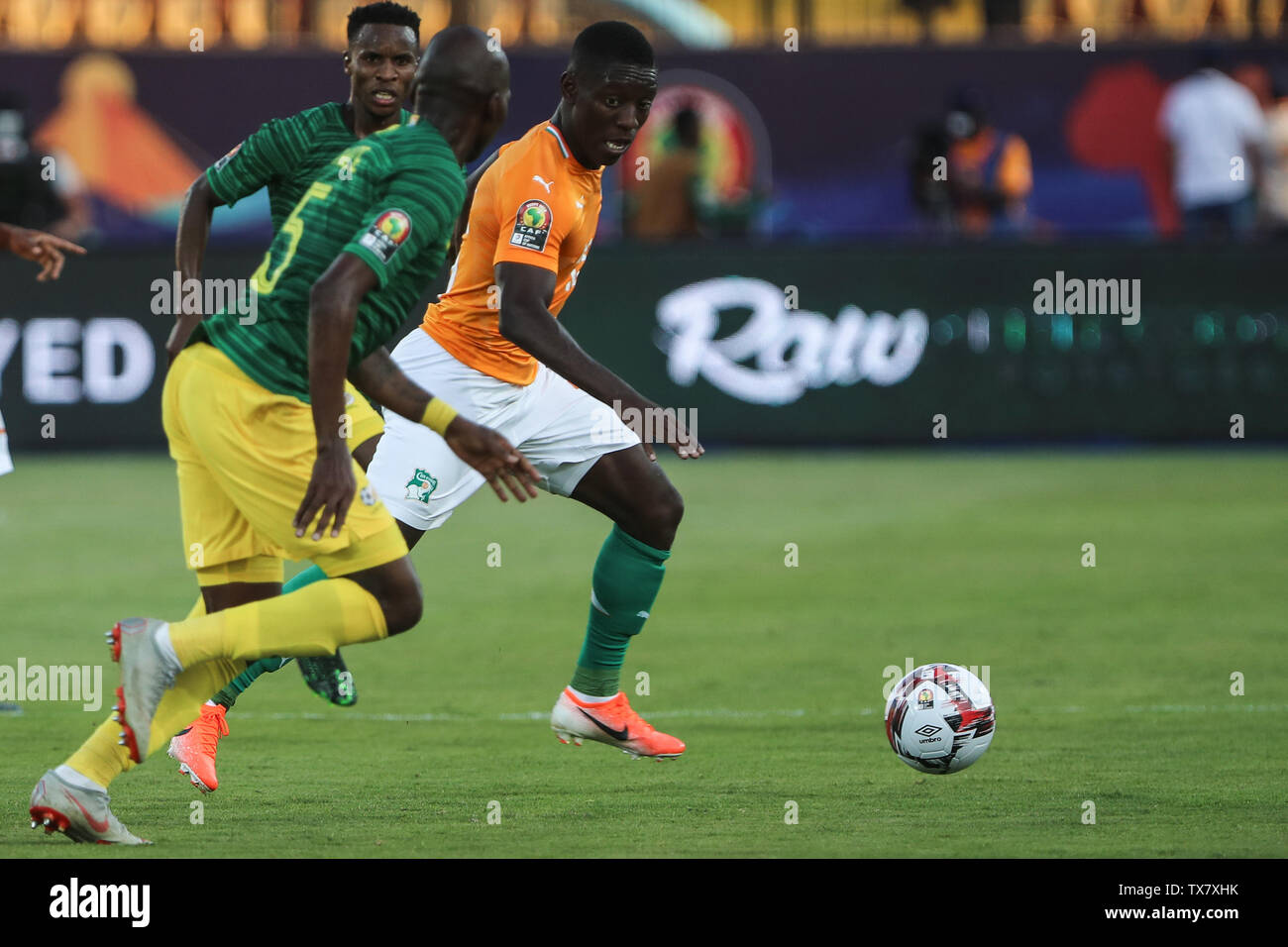 Cairo, Egypt. 24th June, 2019. Ivory coast's Max-Alain Gradel and South Africa's Thamsanqa Mkhize battle for the ball during the 2019 Africa Cup of Nations Group D soccer match between South Africa and Ivory coast at Al-Salam Stadium. Credit: Omar Zoheiry/dpa/Alamy Live News Stock Photo