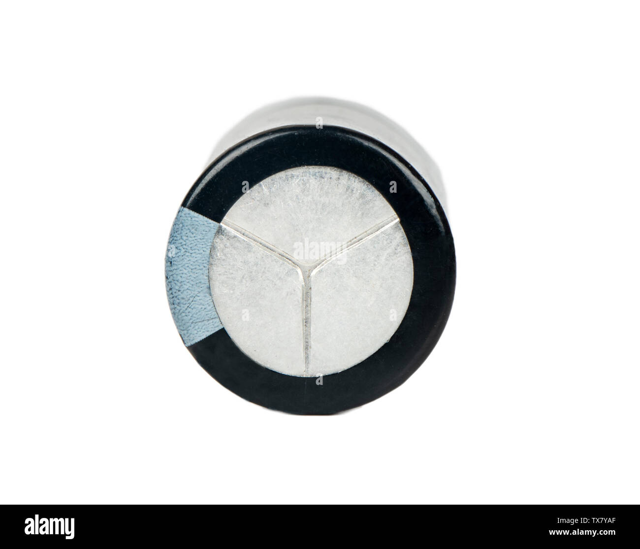 Black radio capacitor detail isolated on white background, top view Stock Photo