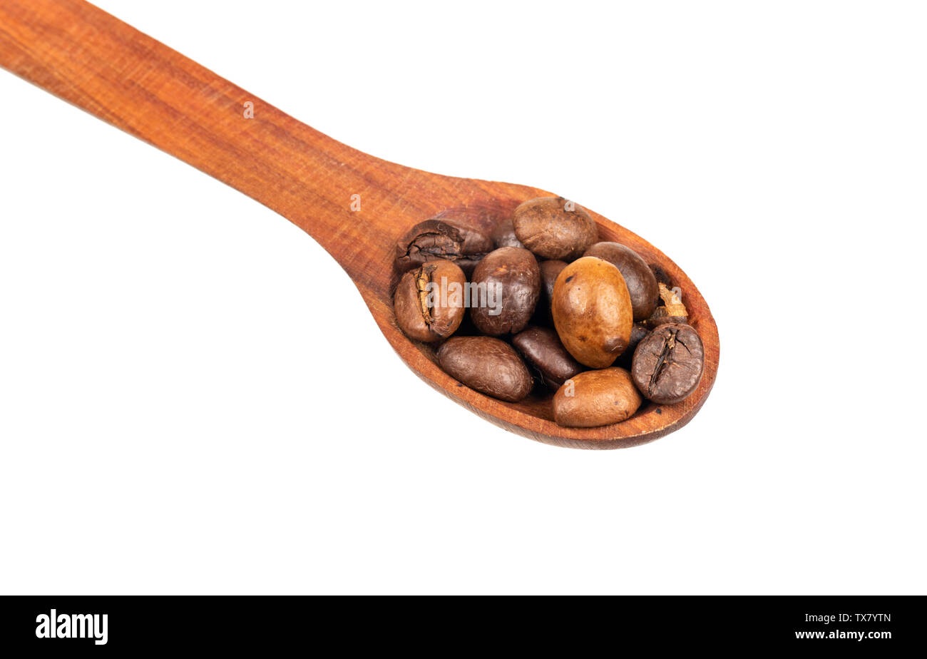 Coffee beans in wooden spoon closeup on white background Stock Photo ...