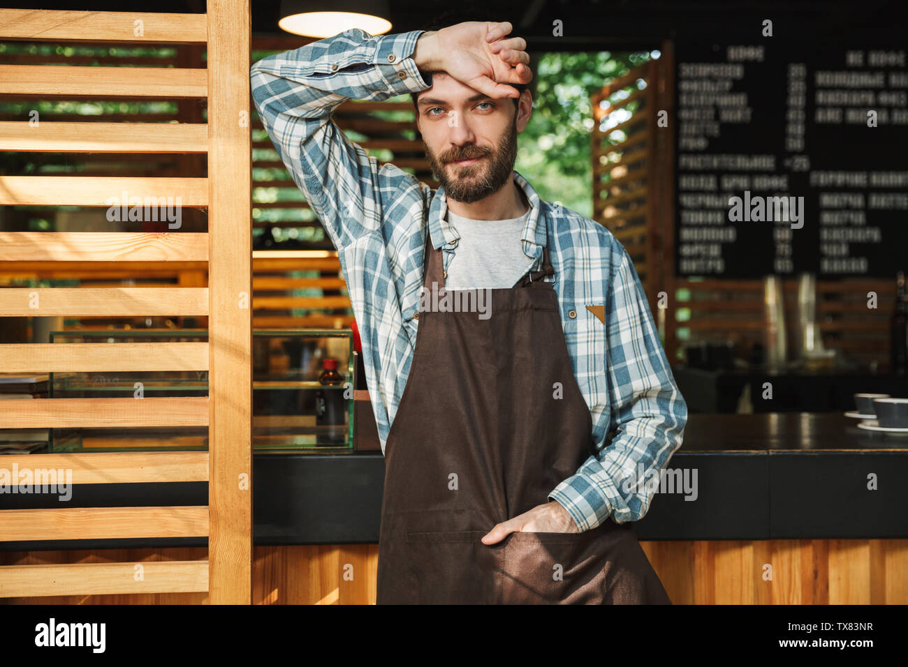 Hospitality staff. Barista handsome worker. Man cook wear apron. Mature  barista. Restaurant staff. Hipster professional barista apron uniform.  Waiter or bartender. Cafe bar barista job position Stock Photo - Alamy