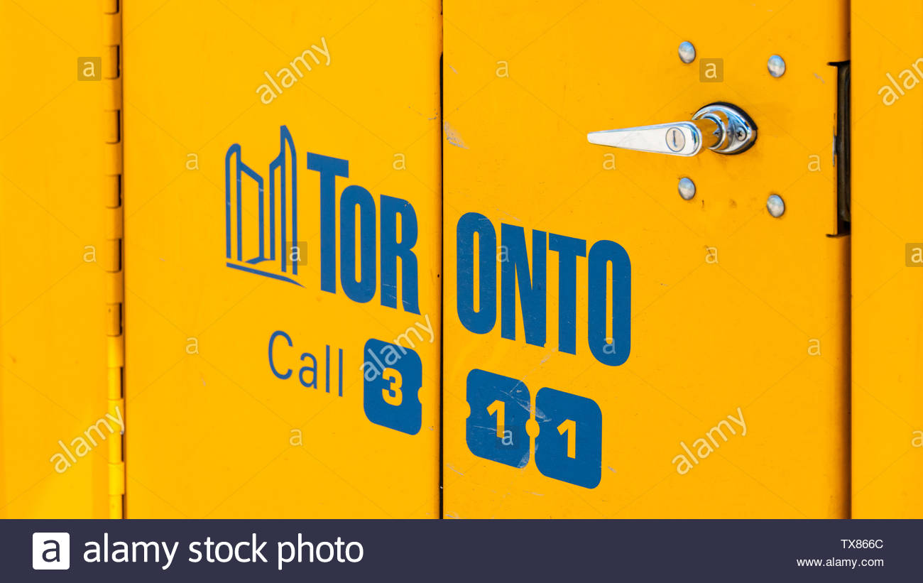 The Blue Logo For The City Of Toronto Seen In The Door Of A Land
