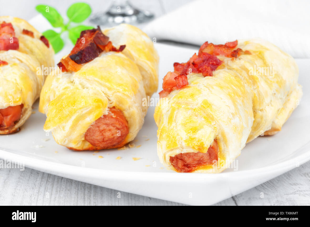 Puff pastry snacks with sausage and bacon Stock Photo Alamy