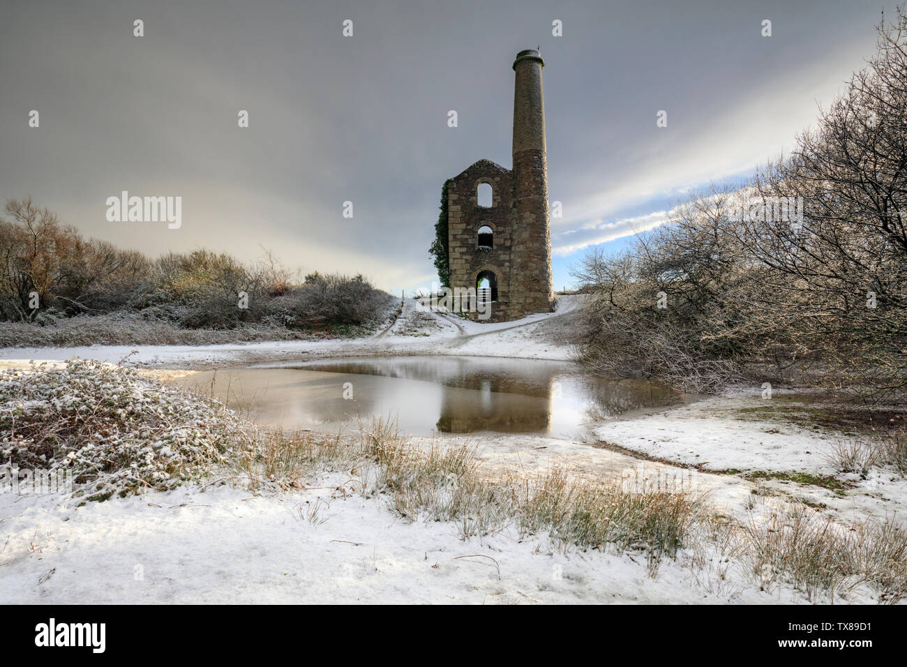 Snow ar Cake and Ale Engine House on United Downs in Cornwall. Stock Photo