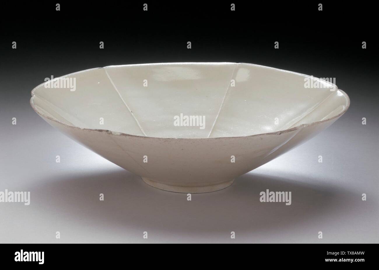Lobed Bowl (Wan);  China, Northern Song dynasty, 960-1127 Furnishings; Serviceware Ding ware, wheel-thrown stoneware with transparent glaze and metal rim Height:  2 1/4 in. (5.7 cm); Diameter:  8 in. (20.32 cm) Gift of Nasli M. Heeramaneck (M.73.48.108) Chinese Art; 960-1127; Stock Photo