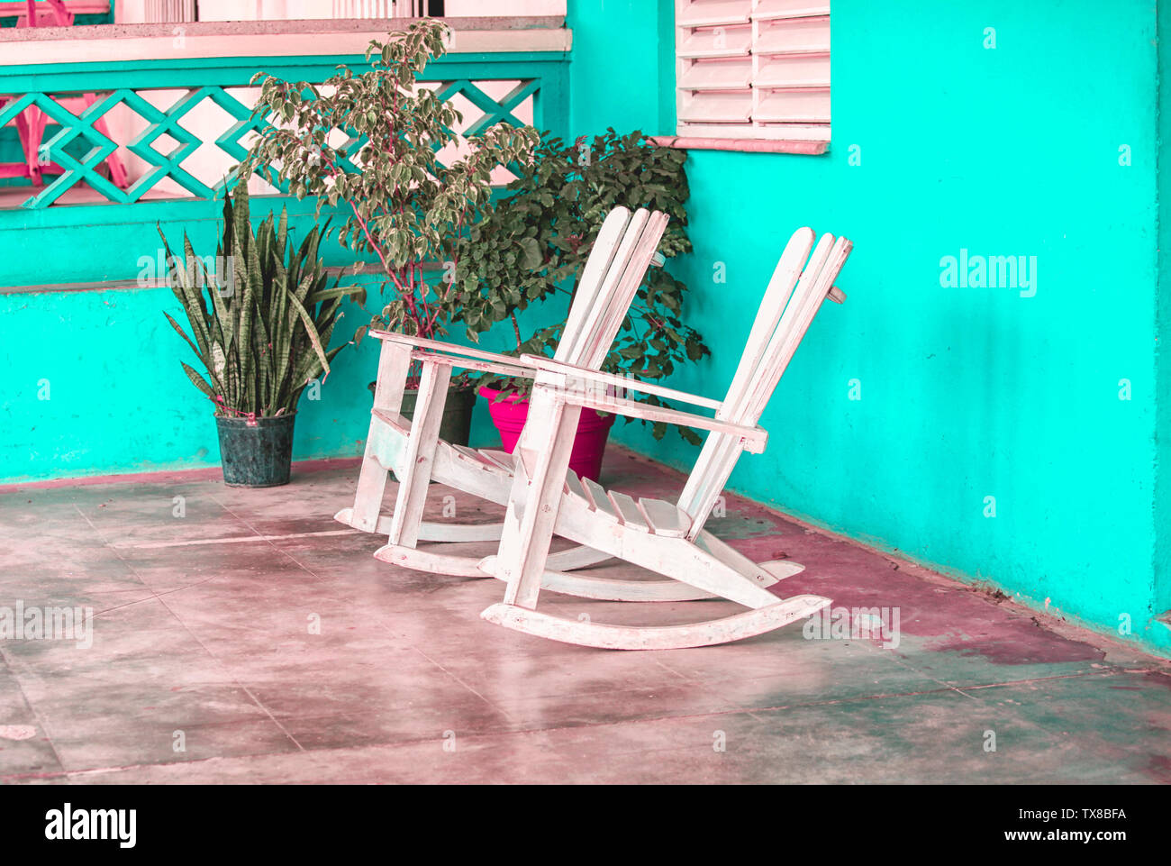 Two wooden rocking chairs on a porch in the Caribbean Stock Photo