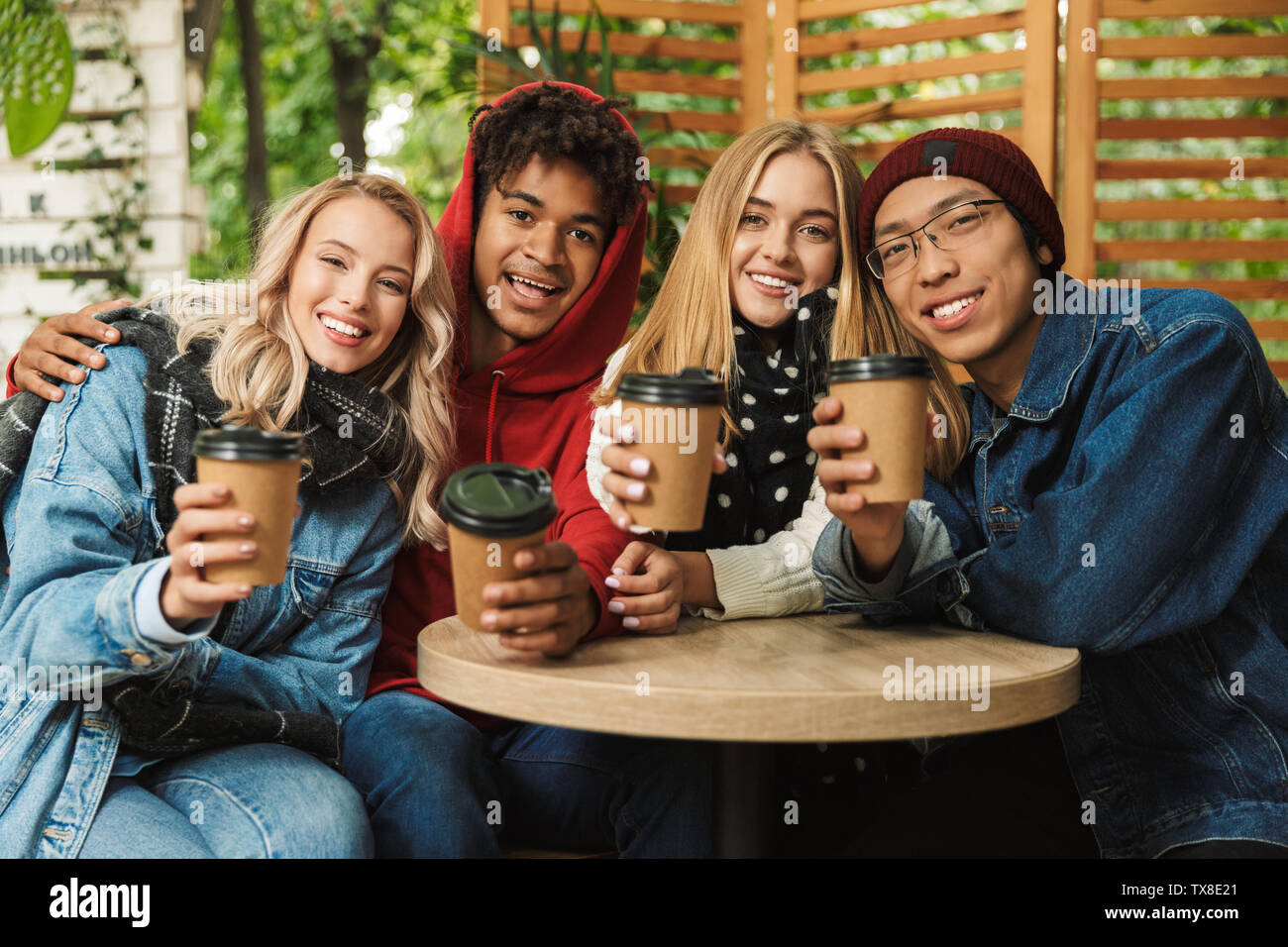 Group If Cheerful Multiethnic Friends Teenagers Spending Fun Time Together Outdoors Drinking Coffee At A Cafe Stock Photo Alamy Group If Cheerful Multiethnic Friends Teenagers Spending Fun Time Together Outdoors Drinking Coffee At A Cafe Stock Photo Alamy
