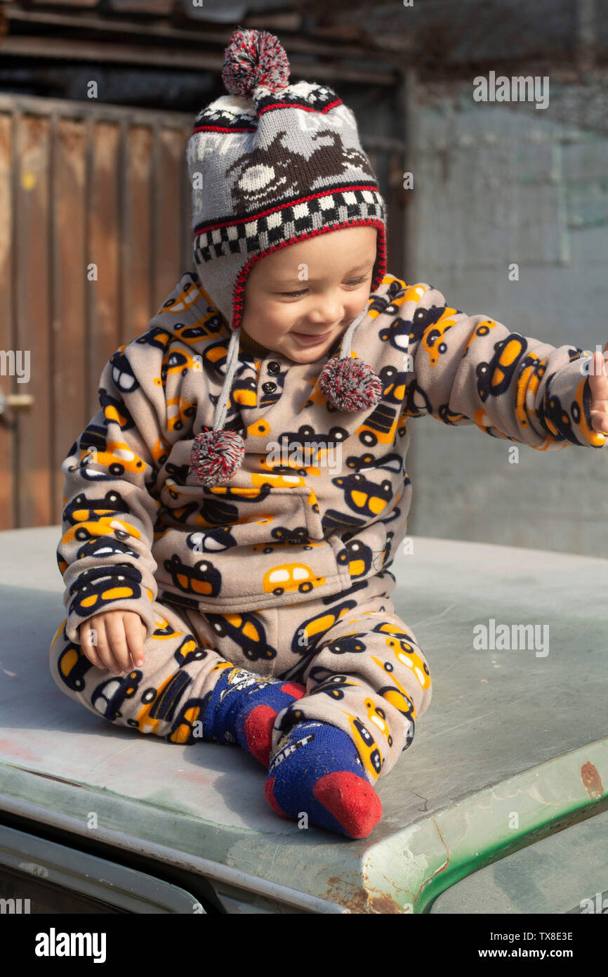Winter clothing baby boy with the cutest smile ever Stock Photo Alamy