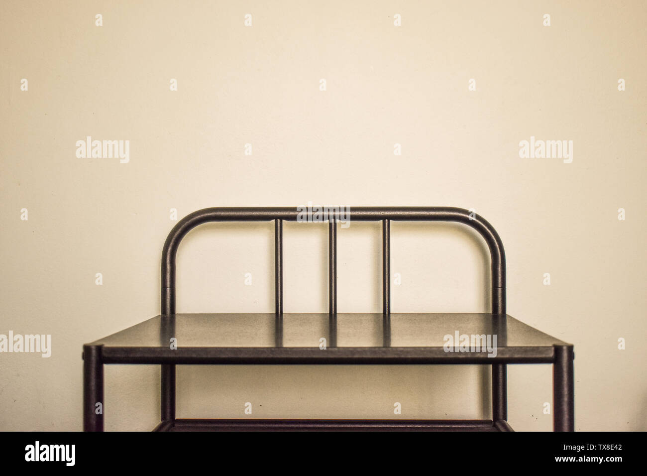 Metal Bedside Table Or Nightstand With White Wall In Background Styled Stock Photography With Free Copy Space For Text Artwork Or Digital Mock Up Stock Photo Alamy