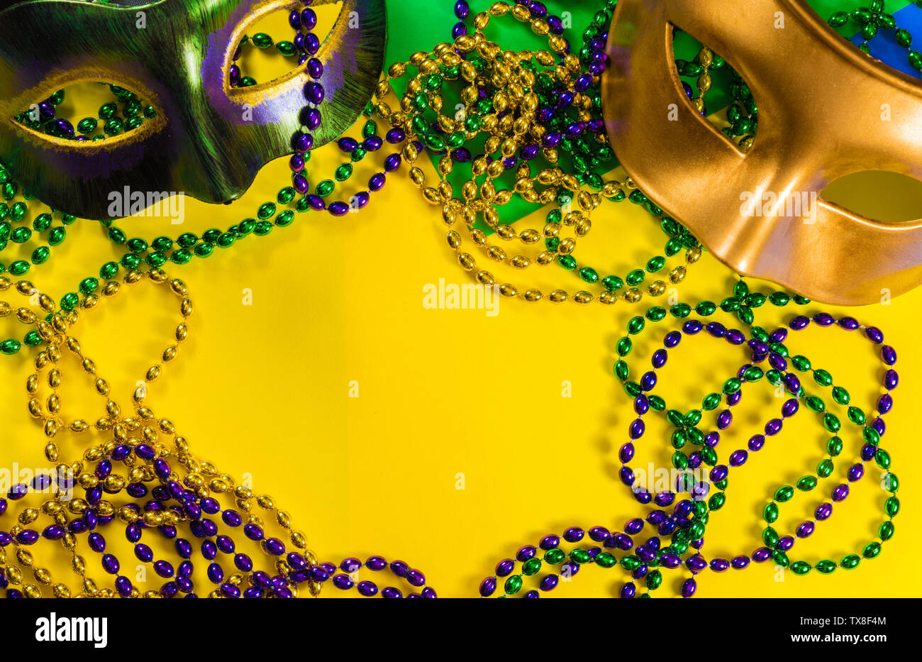 Download Two Mardi Gras Mask With Colorful Beads On A Yellow Background Stock Photo Alamy PSD Mockup Templates