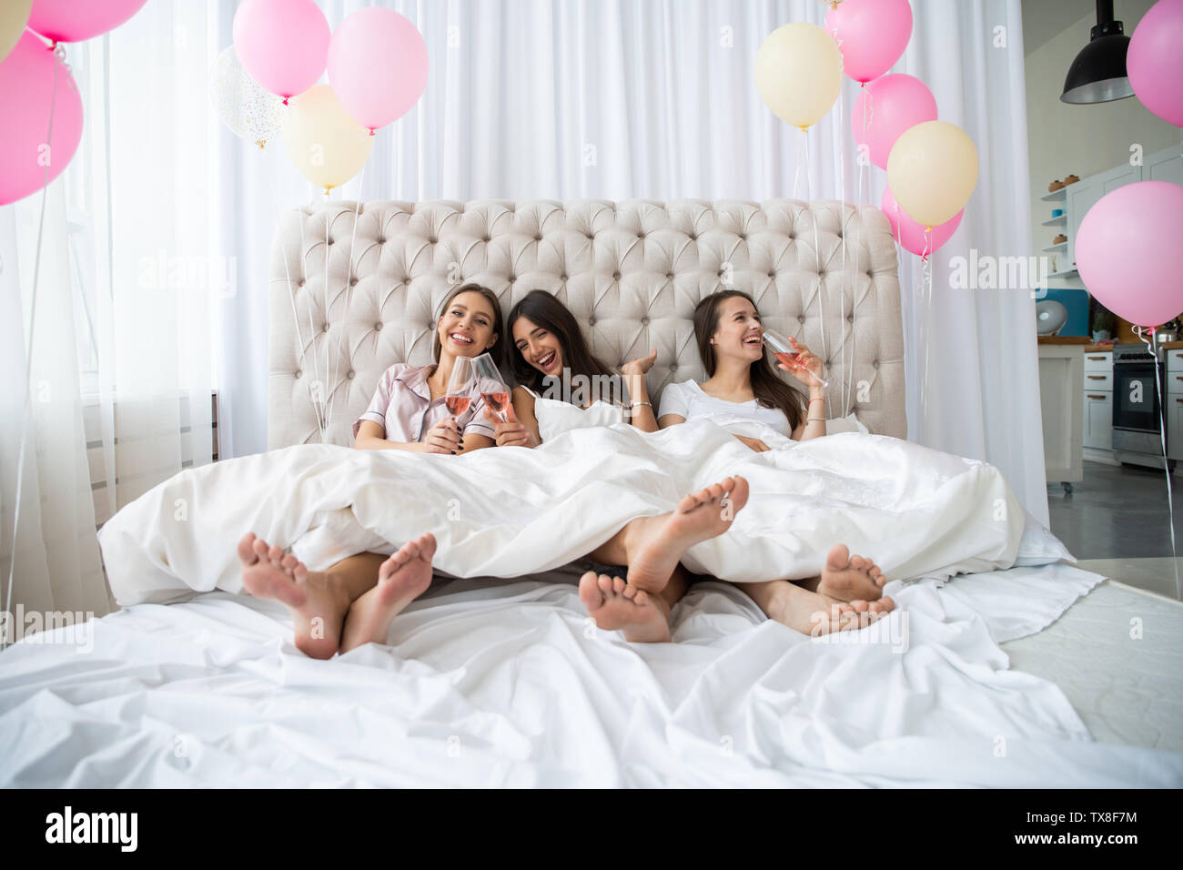 Bed party. Pyjama party at home Stock Photo - Alamy
