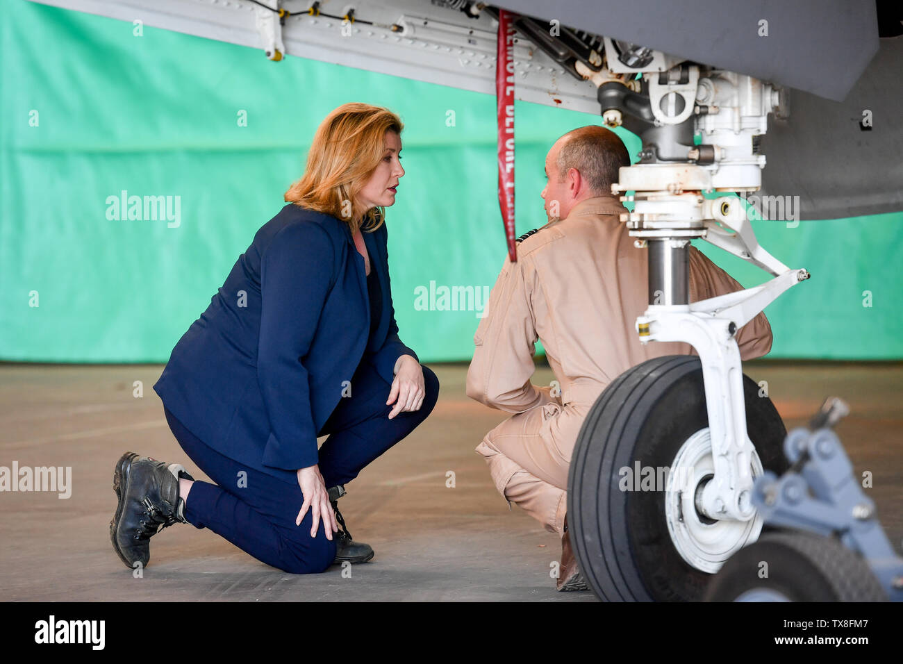 The Defence Secretary Penny Mordaunt being shown around the F-35 jets by John Butcher, officer comanding 617 squadron, at RAF Akrotiri, where she announced that the aircraft have flown on operational missions for the first time as they joined efforts to eradicate Islamic State. Stock Photo