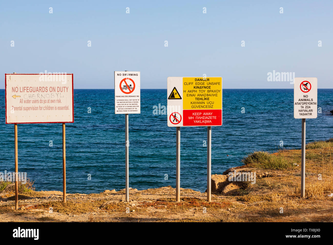 Health and safety warning signs, Xylotymbou fishing shelter, Dhekelia, Larnaca, Cyprus. June 2019 Stock Photo