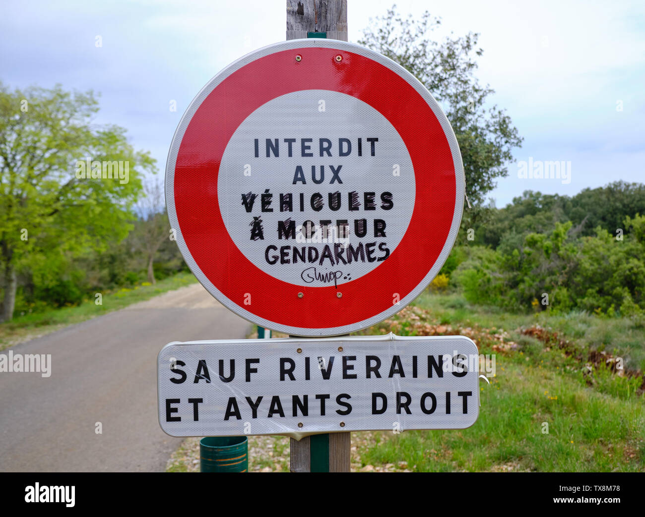 South of France, 2019 : Street sign modified to read 'Forbidden to policeman' highlighting some of the current tension in region Stock Photo