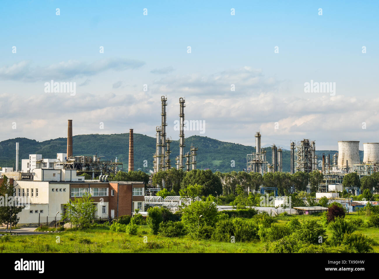 View of old power plant with big concrete furnaces . Fallen chemical communist industry. Stock Photo