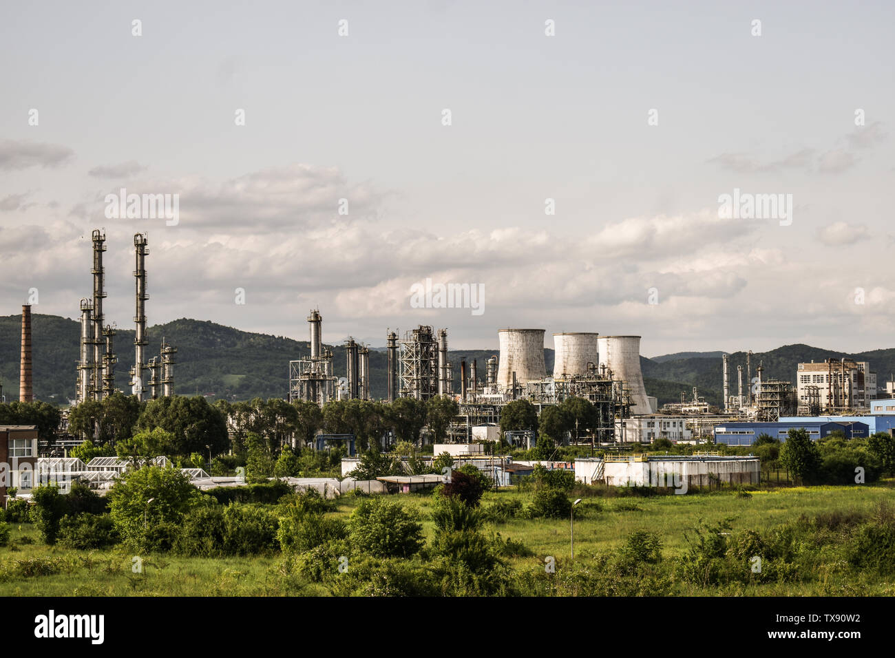 View of old power plant with big concrete furnaces . Fallen chemical communist industry. Stock Photo