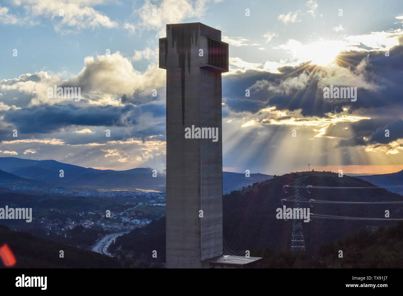Tunnel ventilation tower in highway at dusk. Madrid, Spain Stock Photo