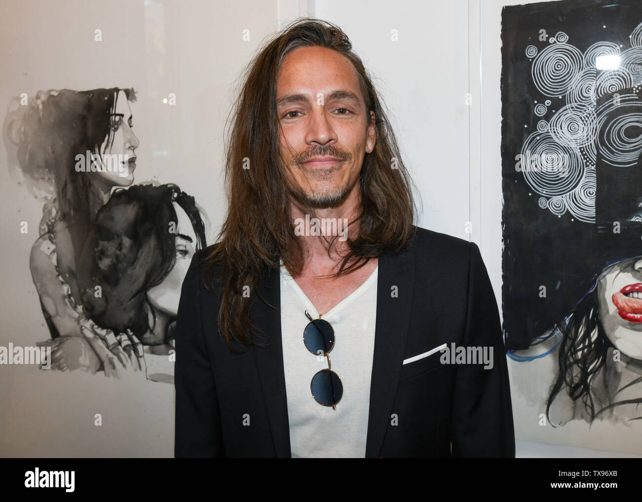 June 23, 2019 - Brandon Boyd with his art work at the 'Love and Art' group show at the Lumber Yard Gallery in Malibu, California. (Credit Image: © Billy Bennight/ZUMA Wire) Stock Photo